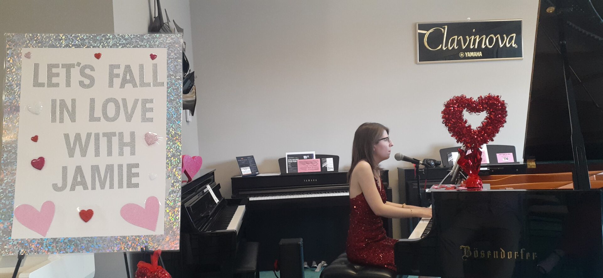 A girl is playing the piano in her room.
