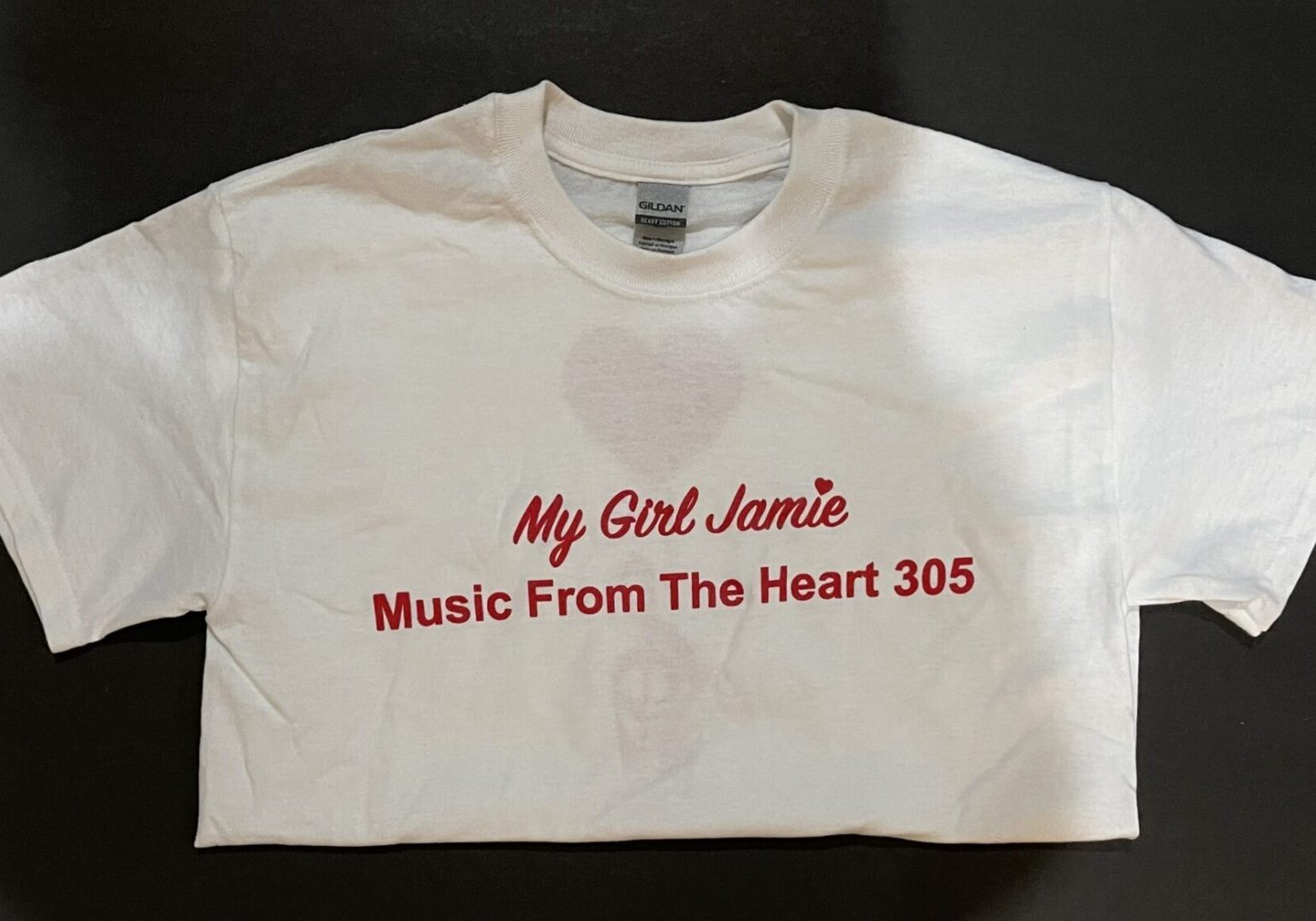 A white t-shirt with the words " my girl jamie music from the heart 3 0 5 ".